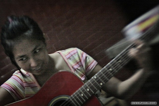 Mic, pretending to play the guitar. Mic, pretending to play the guitar.