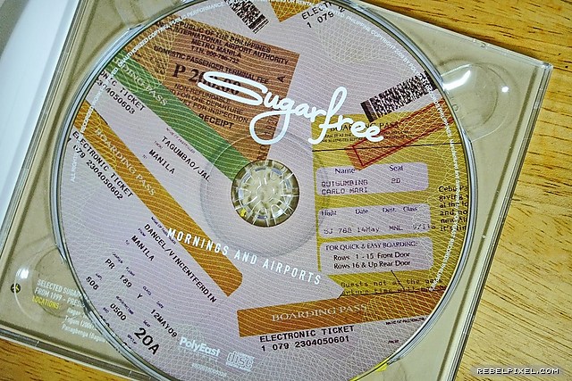 The album CD designed with airline boarding pass images. The album CD designed with airline boarding pass images.
